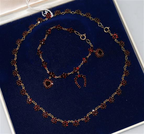 A Victorian style gold and garnet bracelet and a similar sterling silver gilt and garnet necklace.